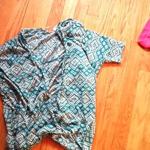 A cute teal blouse with quarter long sleeves